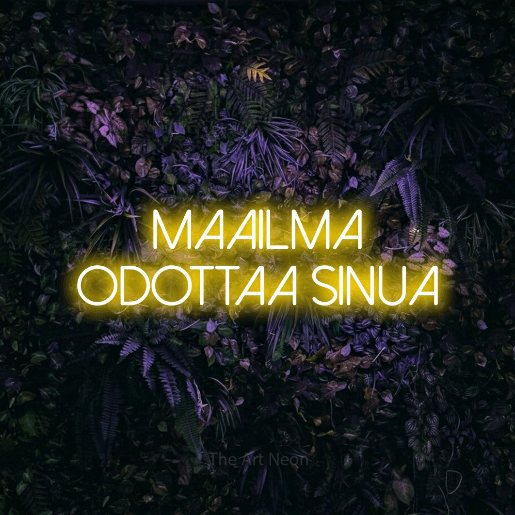 LED neon sign reading “Maailma odottaa sinua”, arranged in 2 lines.