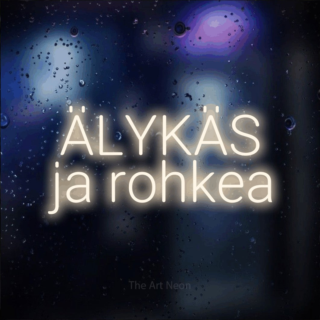 LED neon sign reading “ÄLYKÄS ja rohkea”, arranged in 2 lines.