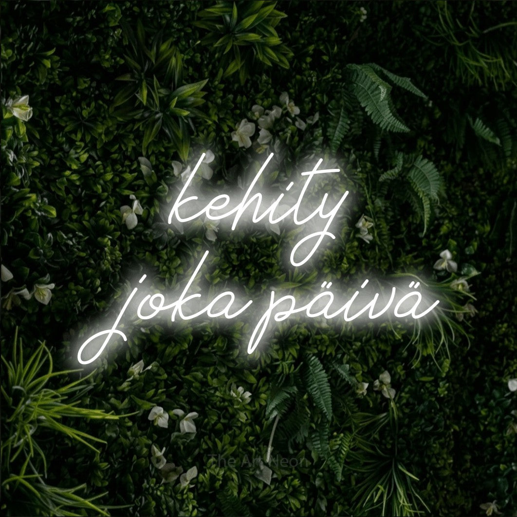 LED neon sign reading “kehity joka päivä”, arranged in 2 lines.