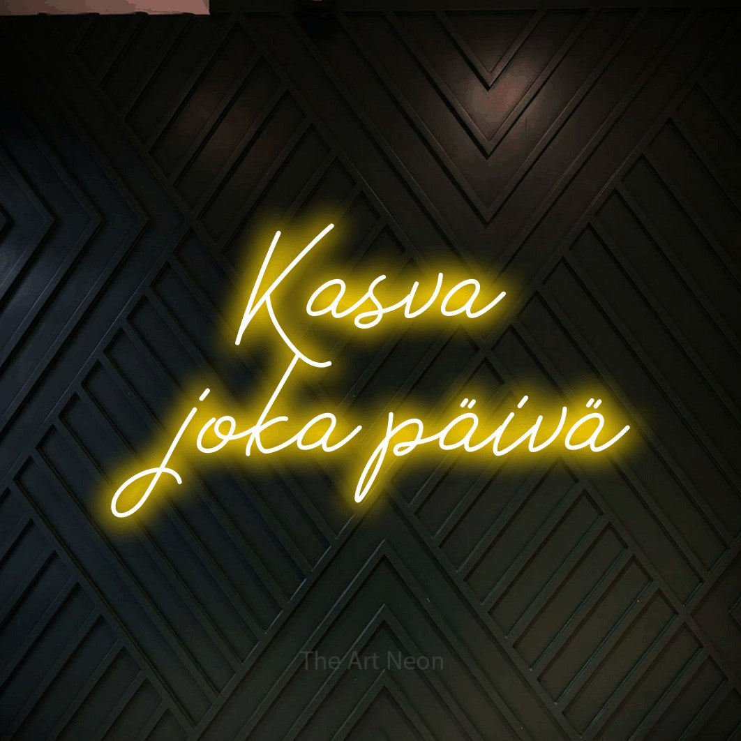 LED neon sign reading “Kasva joka päivä”, arranged in 2 lines.