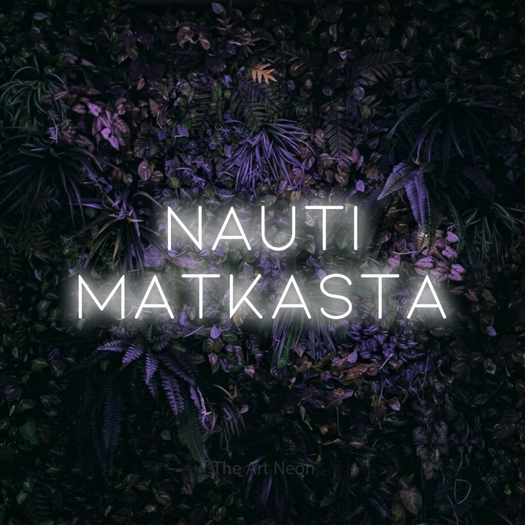 LED neon sign reading “NAUTI MATKASTA”, arranged in 2 lines.