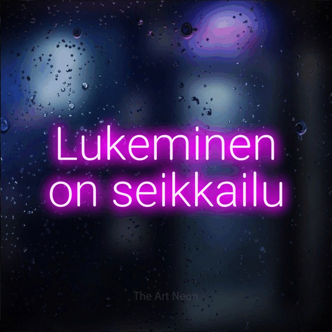 LED neon sign reading “Lukeminen on seikkailu”, arranged in 2 lines.