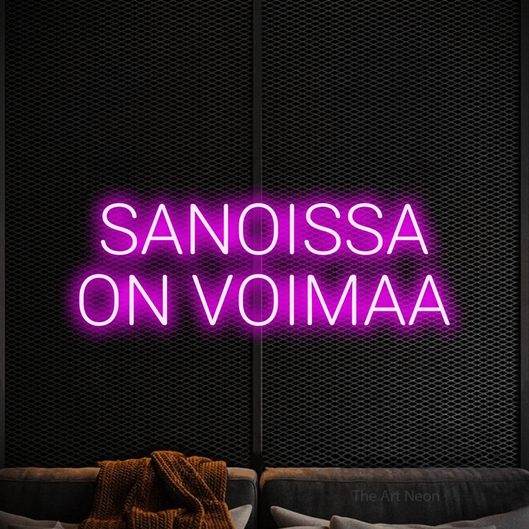 LED neon sign reading “SANOISSA ON VOIMAA”, arranged in 2 lines.
