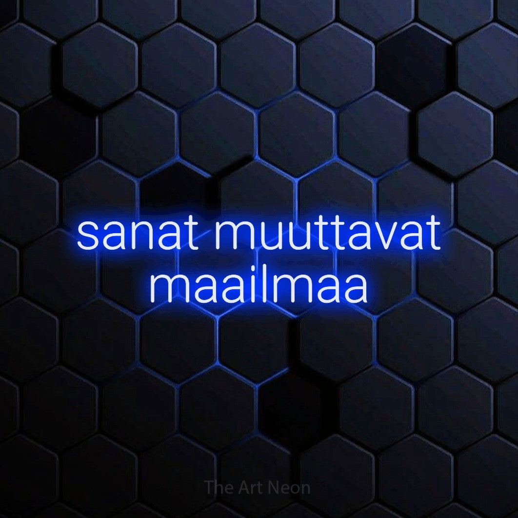 LED neon sign reading “sanat muuttavat maailmaa”, arranged in 2 lines.