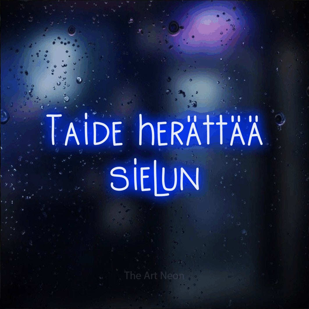 LED neon sign reading “Taide herättää sielun”, arranged in 2 lines.