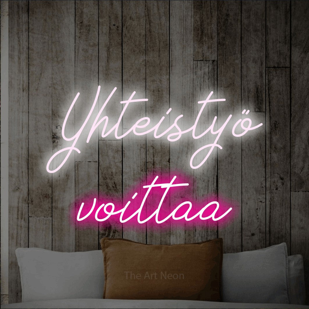 LED neon sign reading “Yhteistyö voittaa”, arranged in 2 lines.
