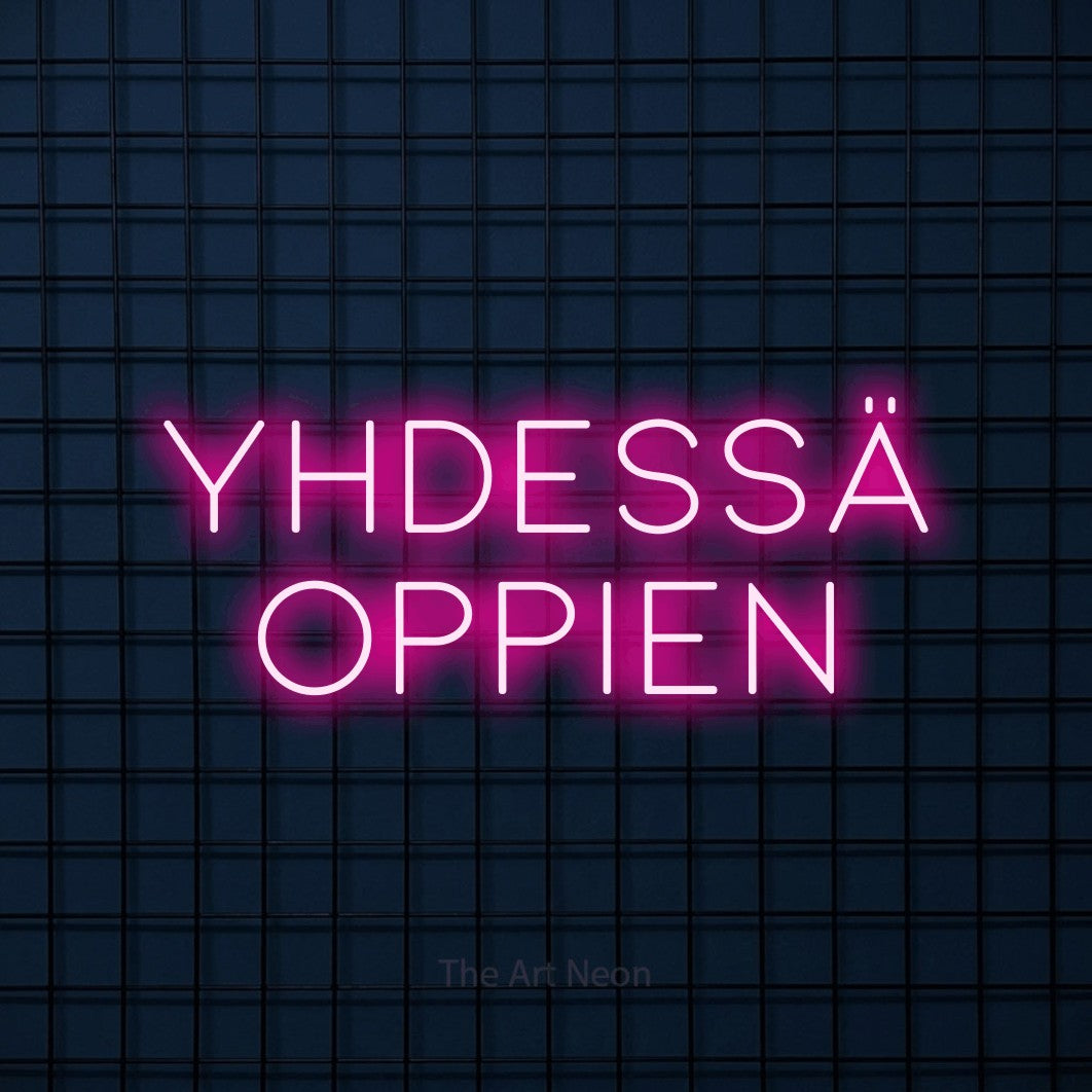 LED neon sign reading “yhdessä oppien”, arranged in 2 lines.
