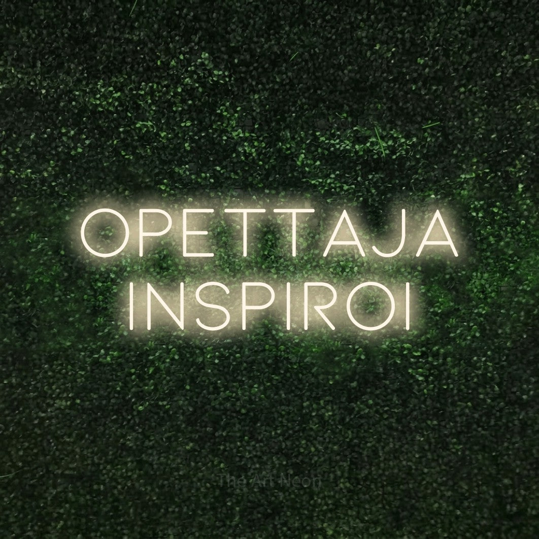LED neon sign reading “opettaja inspiroi”, arranged in 2 lines.