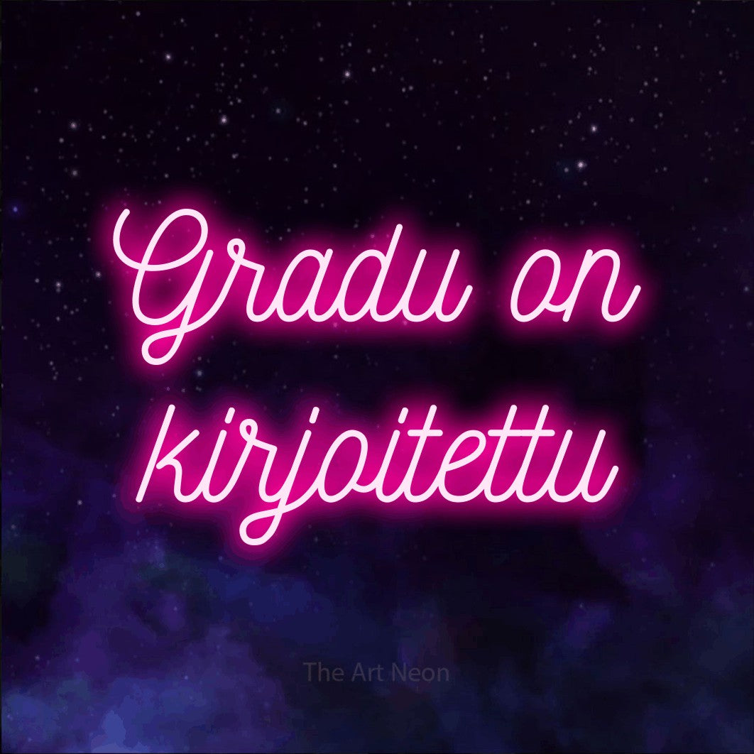 LED neon sign reading “Gradu on kirjoitettu”, arranged in 2 lines.