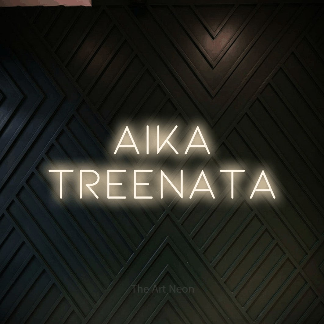 LED neon sign reading “aika treenata”, arranged in 2 lines.