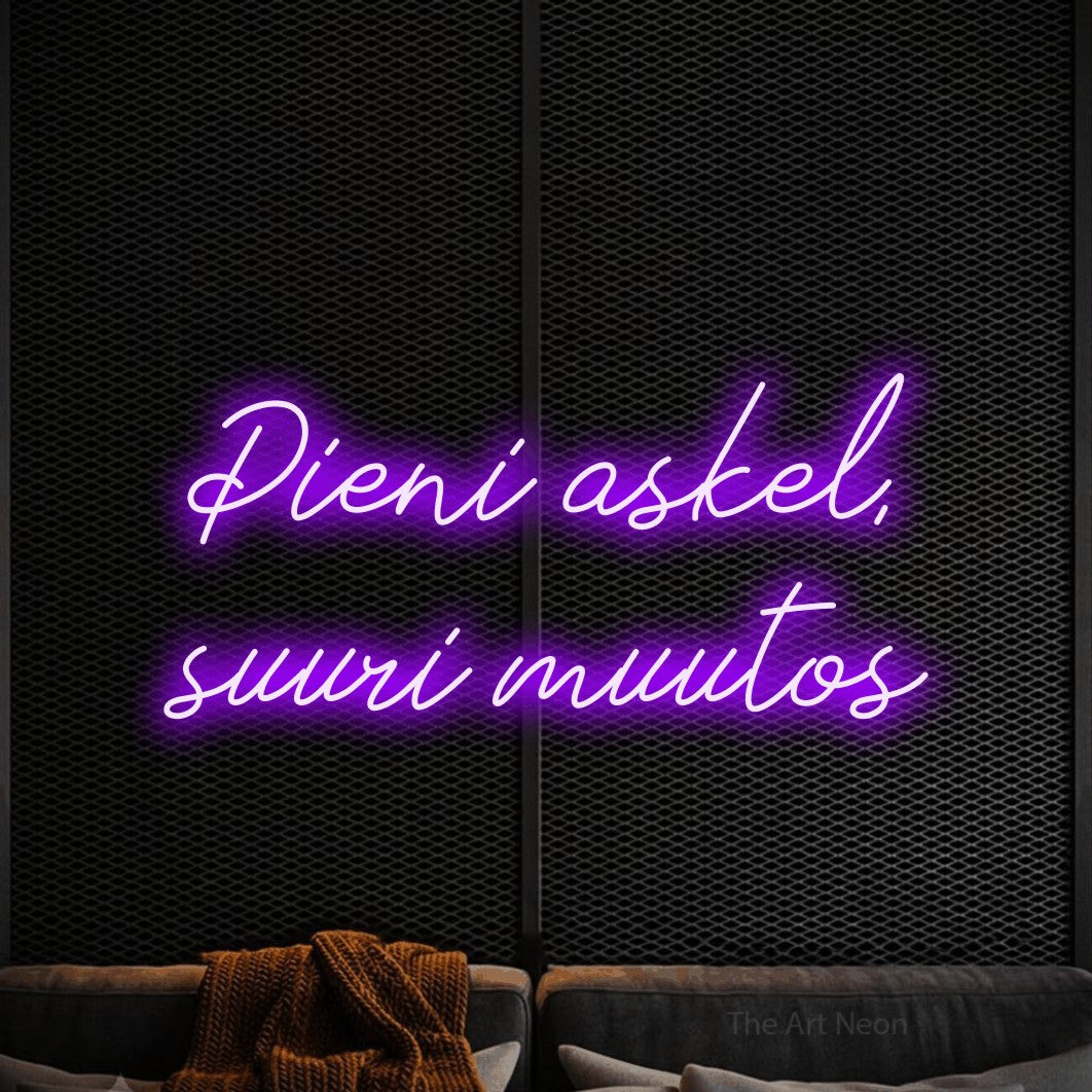 LED neon sign reading “Pieni askel, suuri muutos”, arranged in 2 lines.