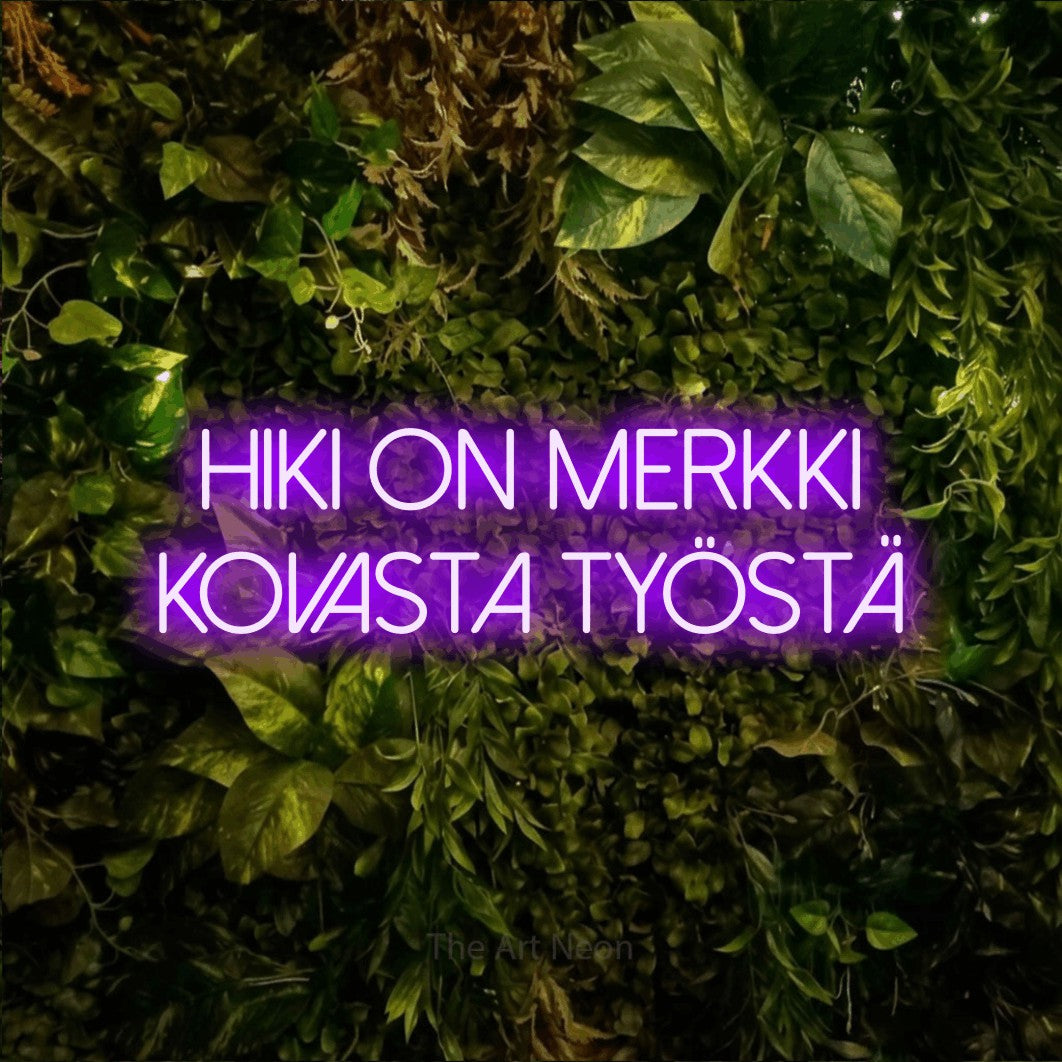 LED neon sign reading “Hiki on merkki kovasta työstä”, arranged in 2 lines.