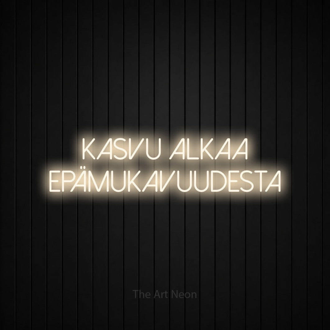 LED neon sign reading “kasvu alkaa epämukavuudesta”, arranged in 2 lines.