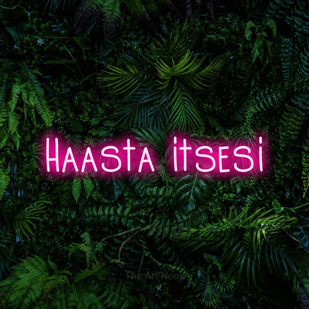 LED neon sign reading “Haasta itsesi”, arranged in a single line.