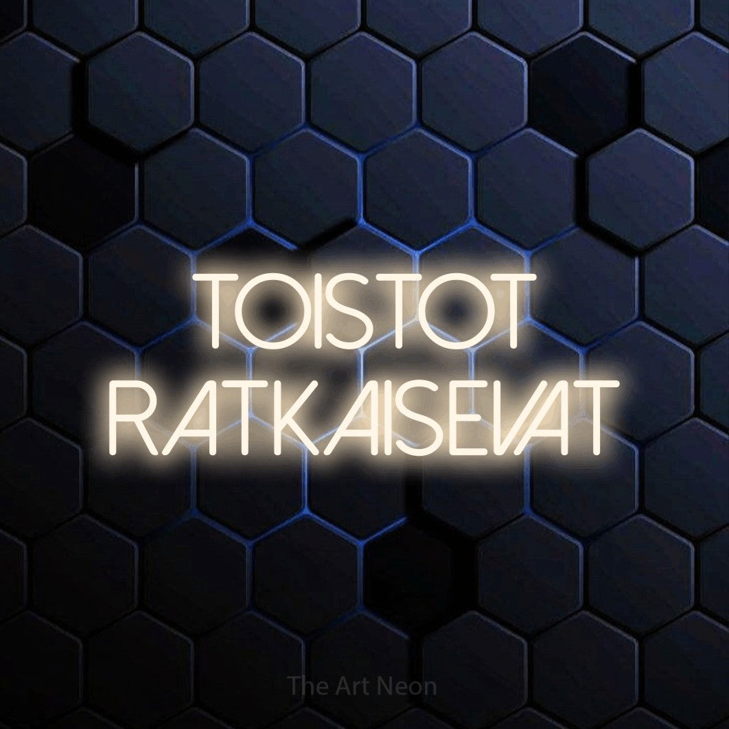 LED neon sign reading “Toistot ratkaisevat”, arranged in 2 lines.