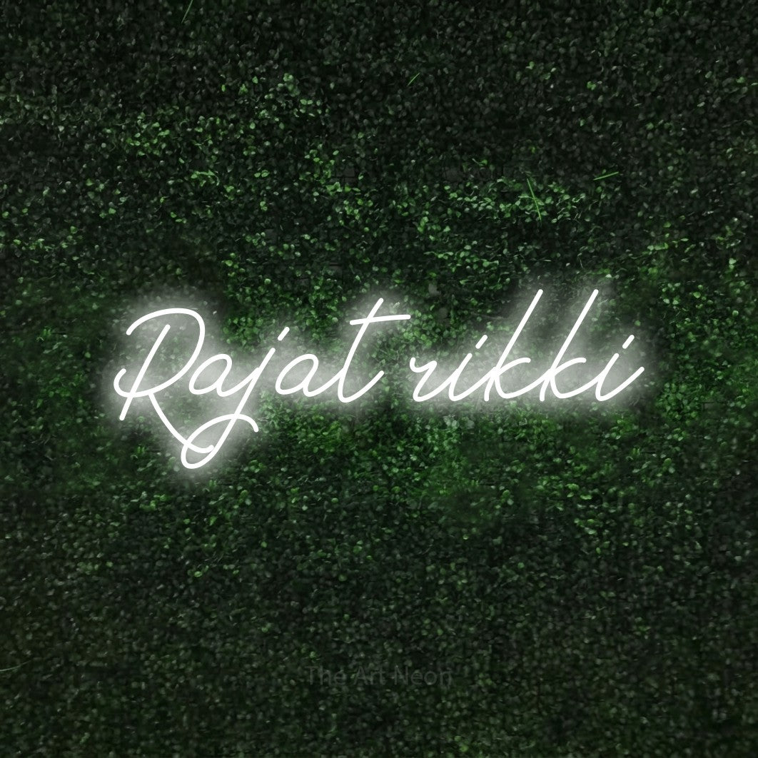 LED neon sign reading “Rajat rikki”, arranged in a single line.