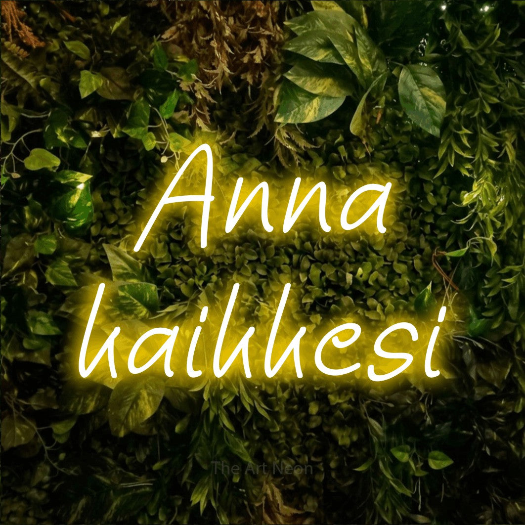 LED neon sign reading “Anna kaikkesi”, arranged in 2 lines.