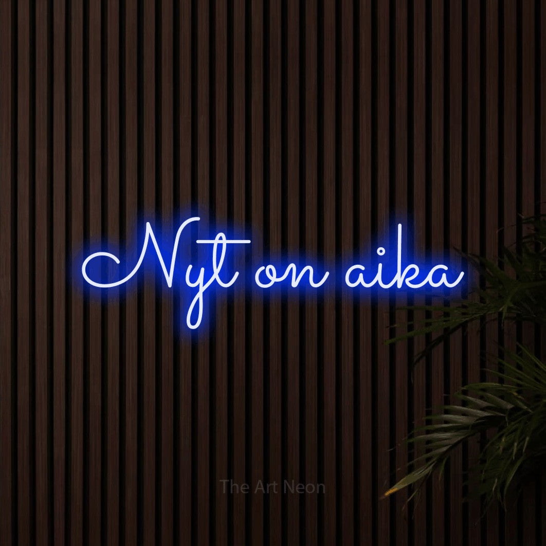 LED neon sign reading “Nyt on aika”, arranged in a single line.