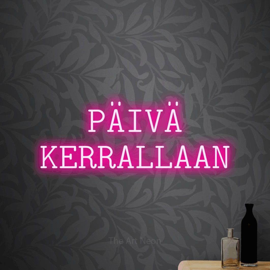 LED neon sign reading “PÄIVÄ KERRALLAAN”, arranged in 2 lines.