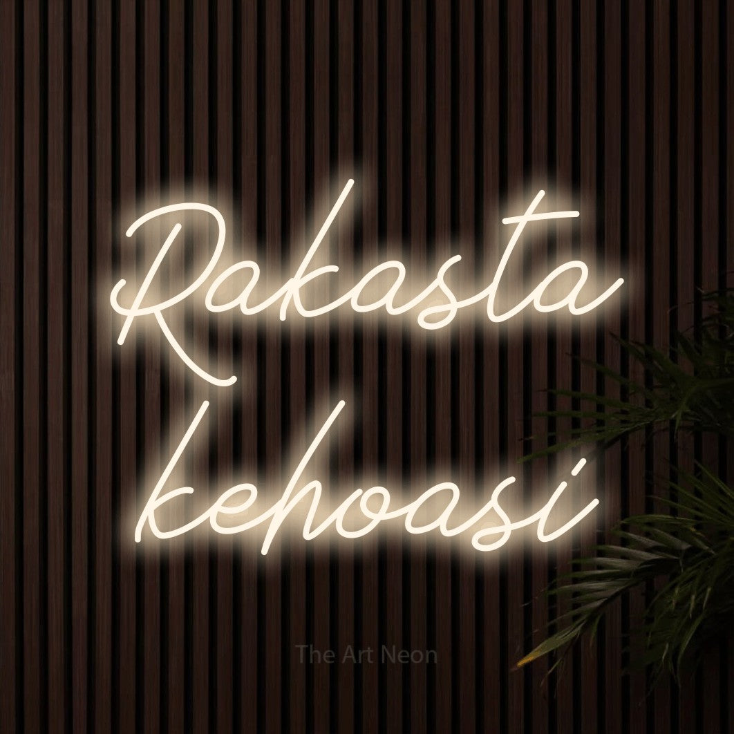 LED neon sign reading “Rakasta kehoasi”, arranged in 2 lines.