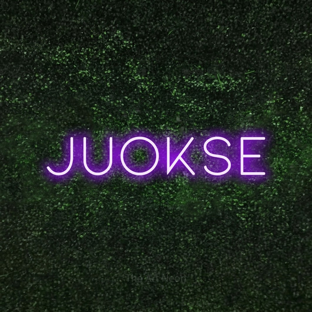 LED neon sign reading “Juokse”, arranged in a single line.