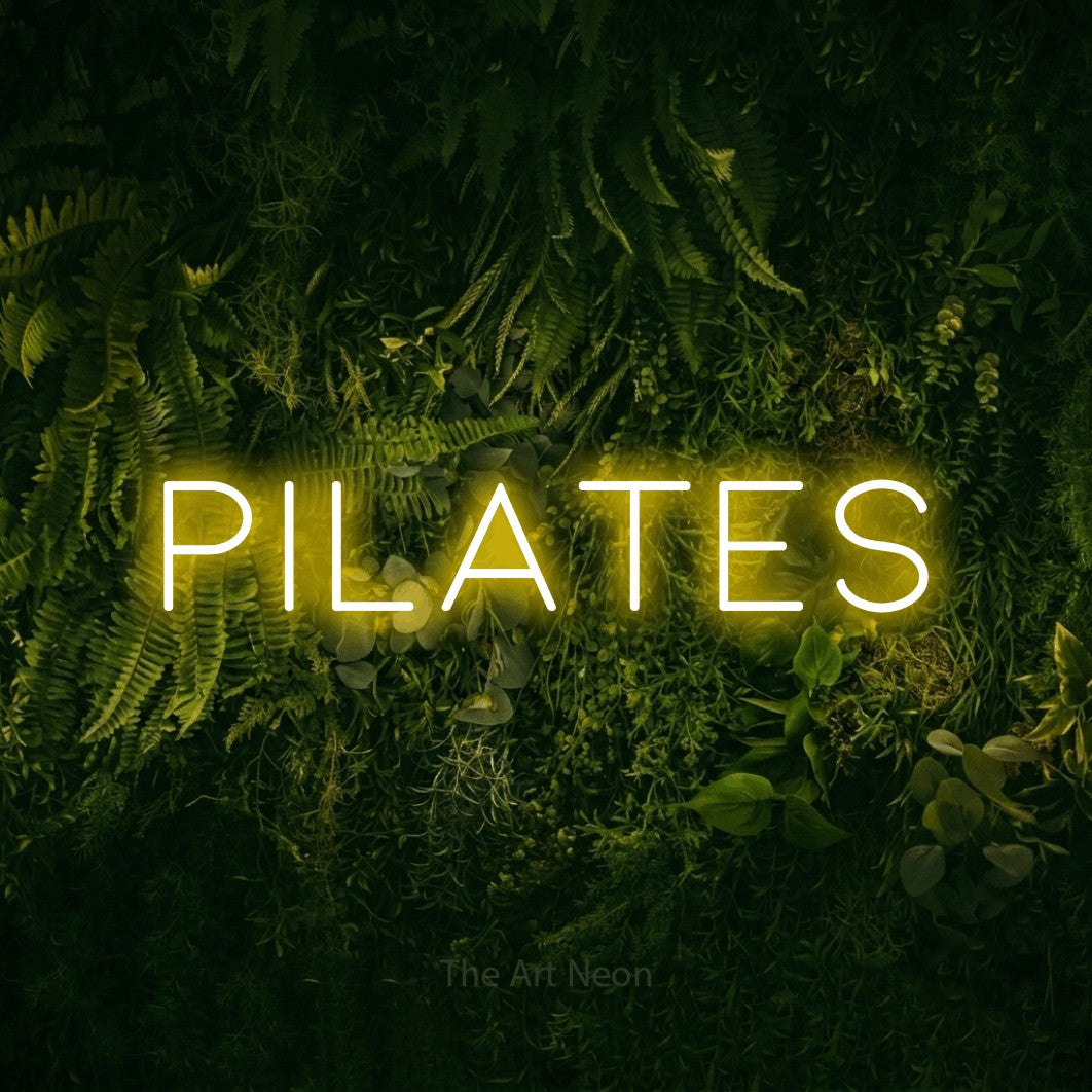 LED neon sign reading “Pilates”, arranged in a single line.
