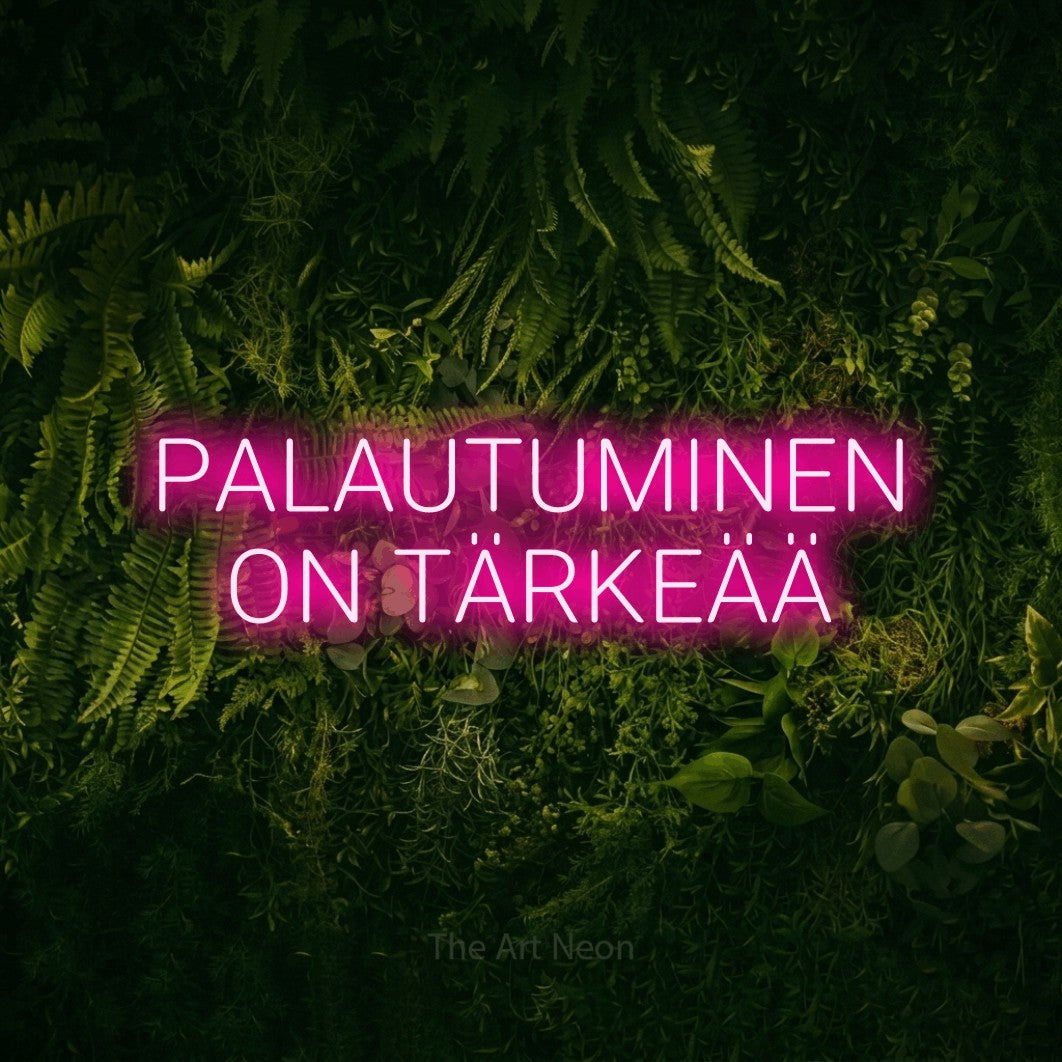 LED neon sign reading “PALAUTUMINEN ON TÄRKEÄÄ”, arranged in 2 lines.