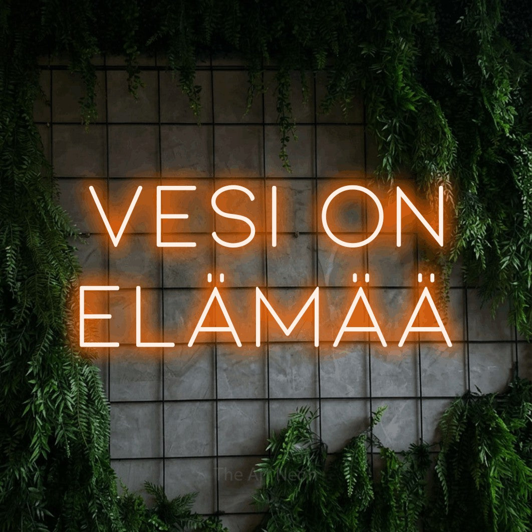 LED neon sign reading “vesi on ELÄMÄÄ”, arranged in 2 lines.