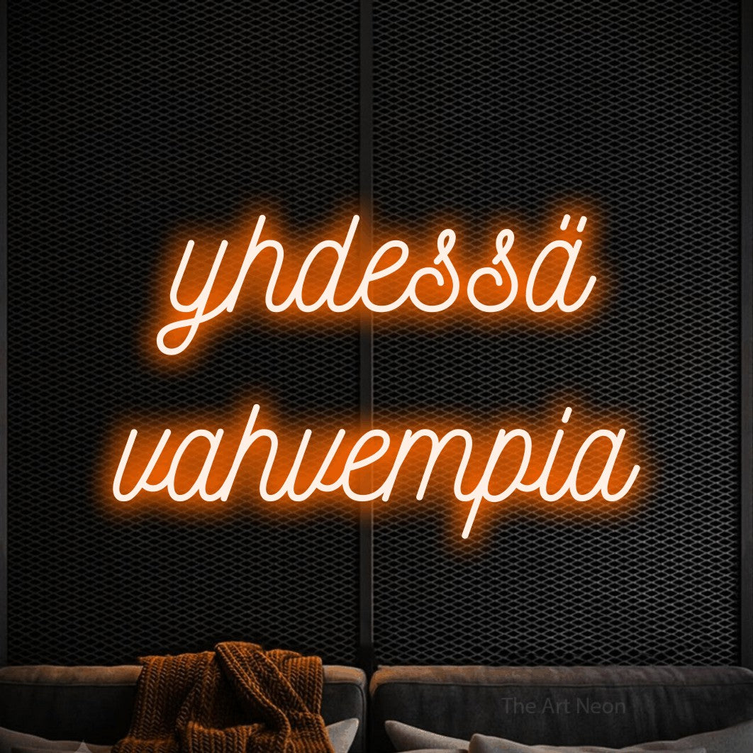 LED neon sign reading “yhdessä vahvempia”, arranged in 2 lines.