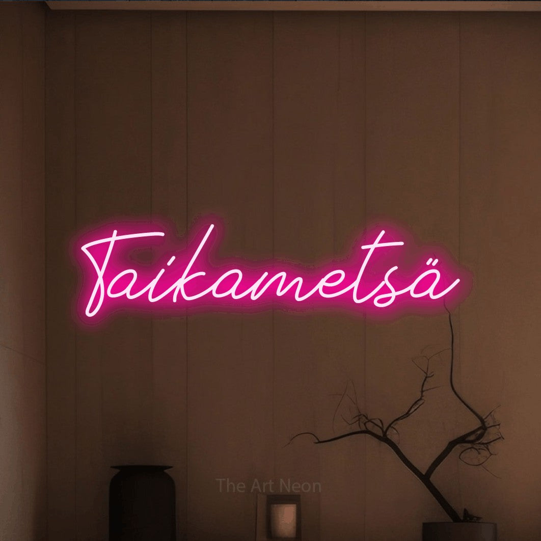 LED neon sign reading “Taikametsä”, arranged in a single line.