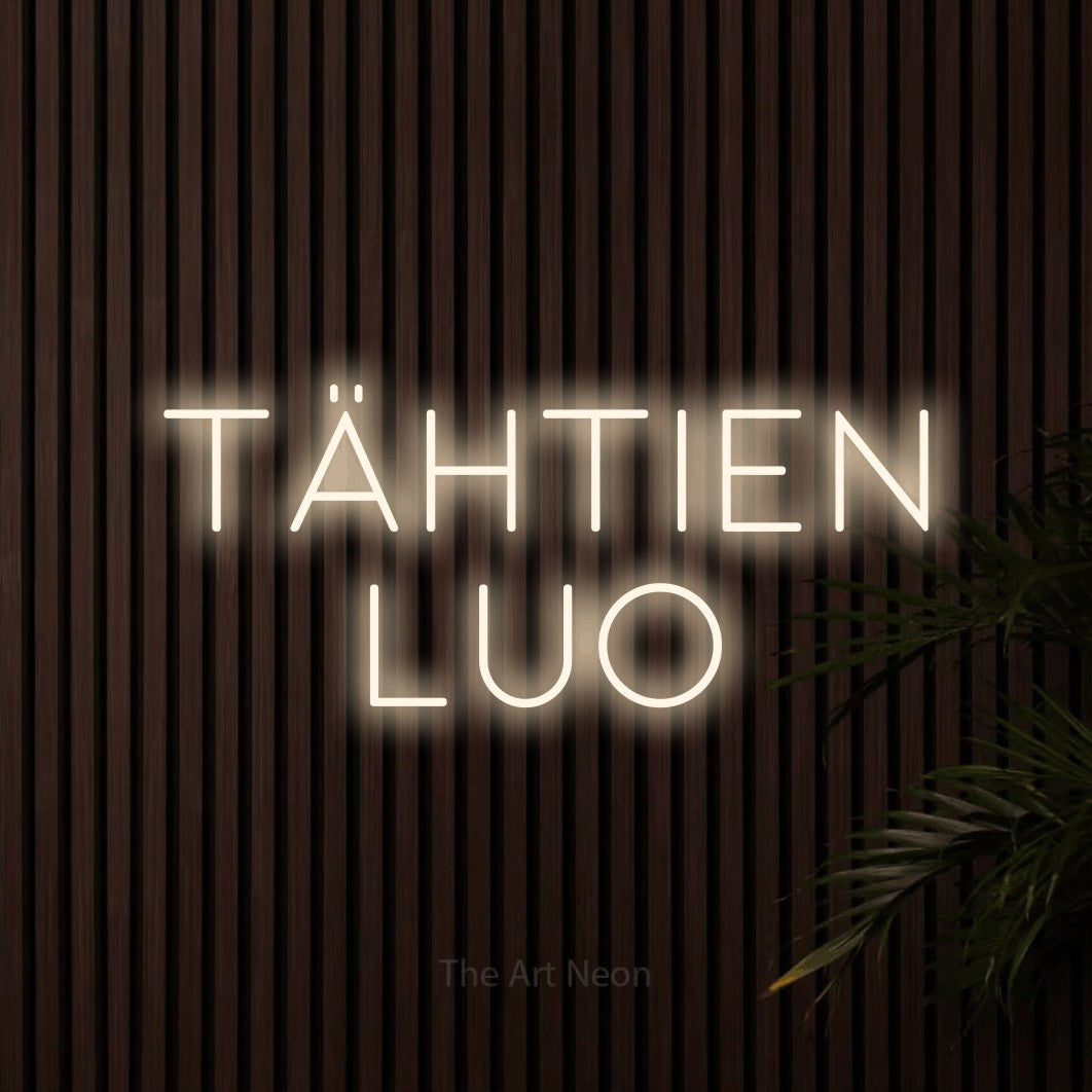 LED neon sign reading “TÄHTIEN LUO”, arranged in 2 lines.