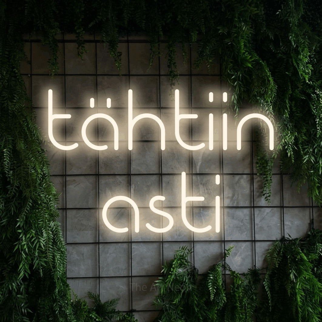 LED neon sign reading “tähtiin asti”, arranged in 2 lines.