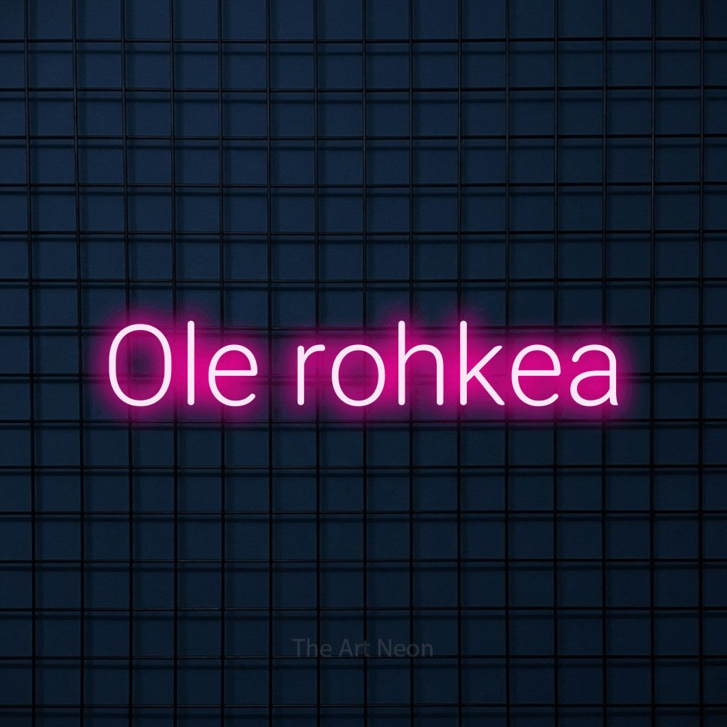 LED neon sign reading “Ole rohkea”, arranged in a single line.