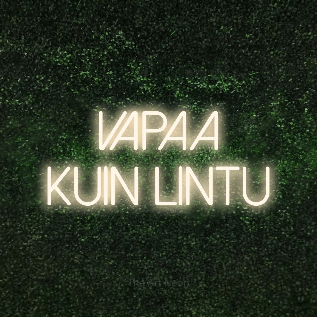 LED neon sign reading “Vapaa kuin lintu”, arranged in 2 lines.