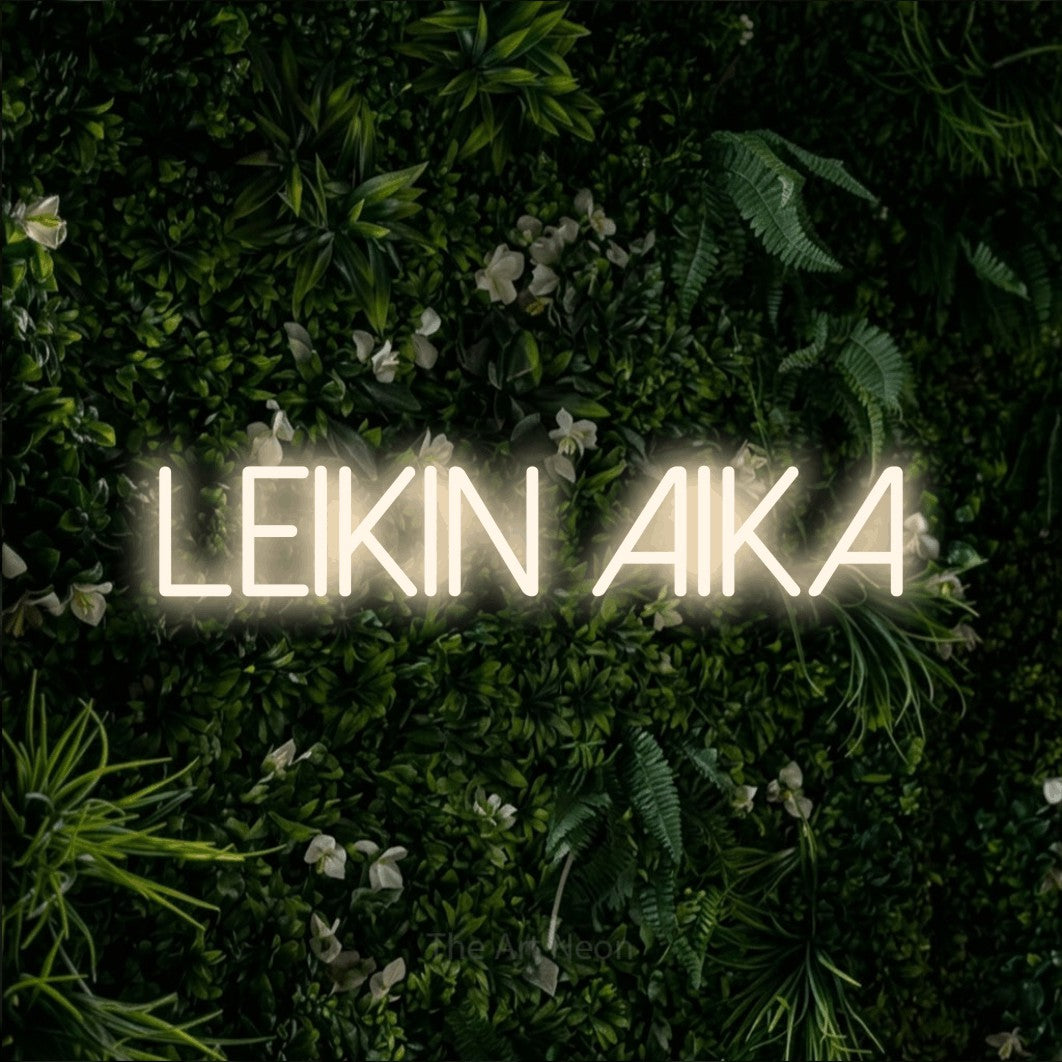 LED neon sign reading “Leikin aika”, arranged in a single line.