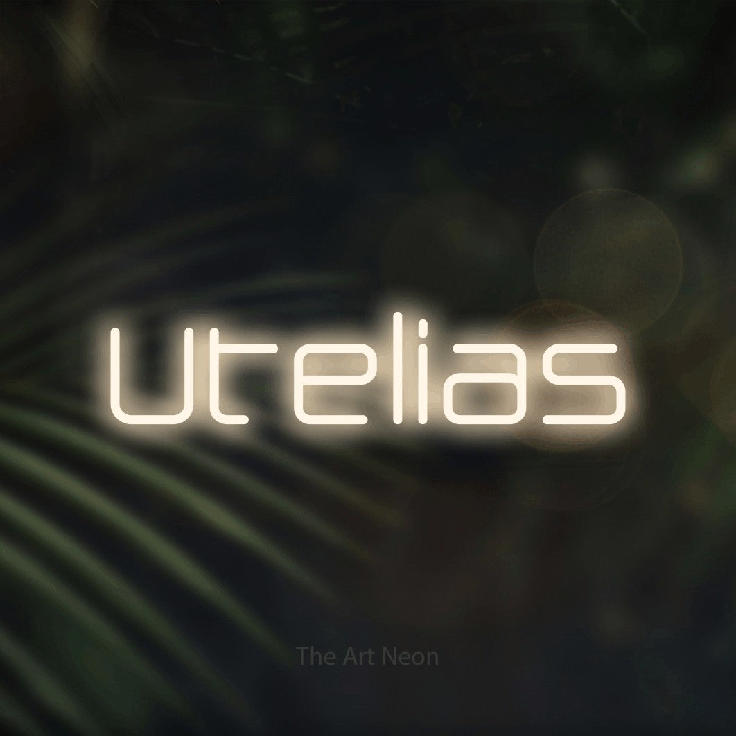 LED neon sign reading “Utelias”, arranged in a single line.