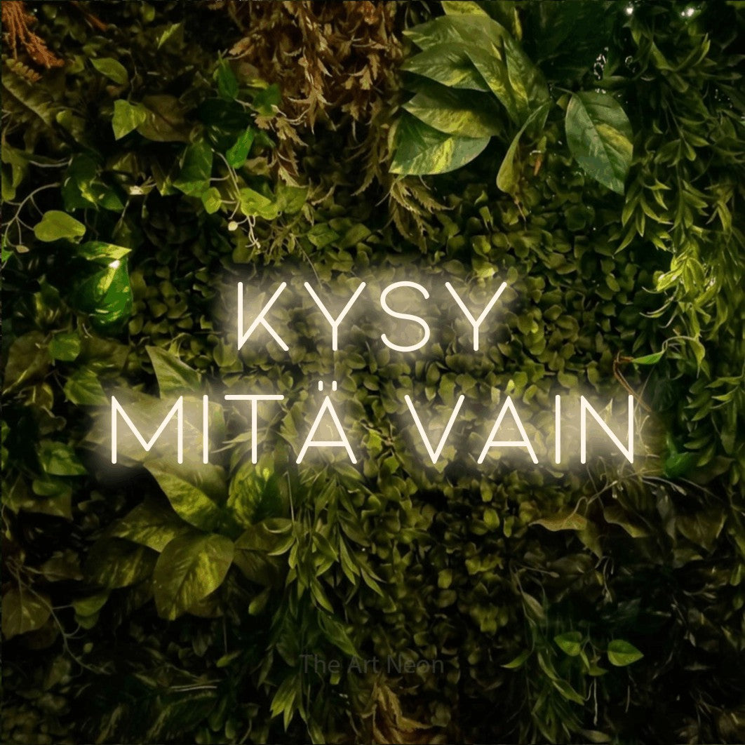 LED neon sign reading “KYSY MITÄ VAIN”, arranged in 2 lines.