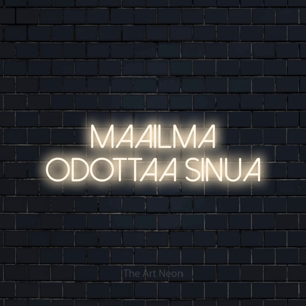 LED neon sign reading “MAAILMA odottaa sinua”, arranged in 2 lines.