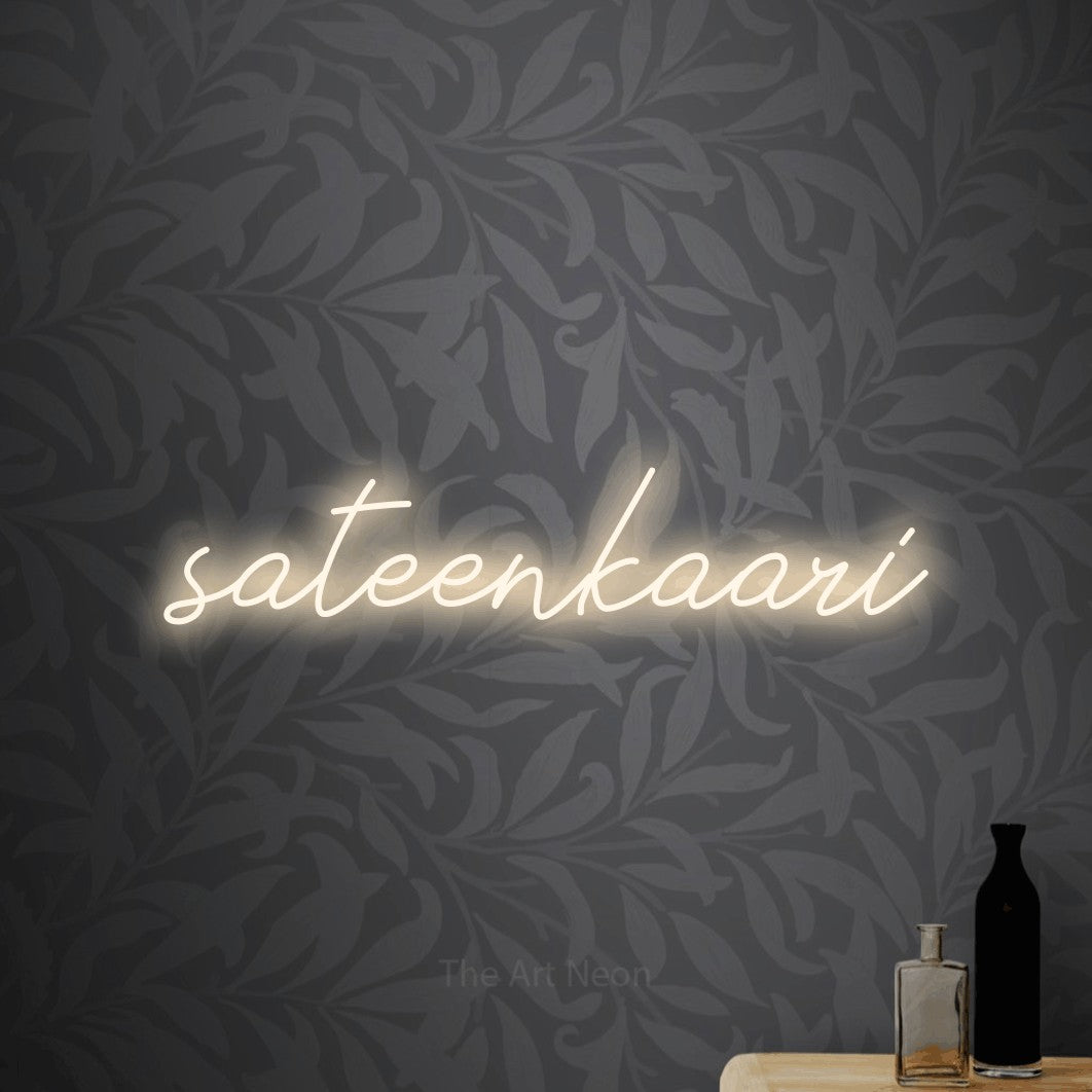 LED neon sign reading “sateenkaari”, arranged in a single line.