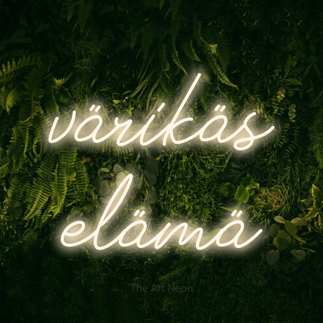 LED neon sign reading “värikäs elämä”, arranged in 2 lines.
