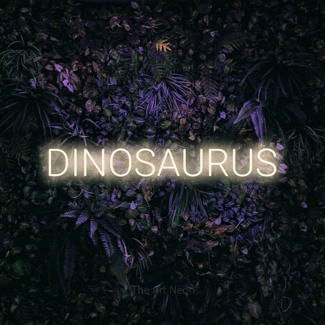 LED neon sign reading “DINOSAURUS”, arranged in a single line.