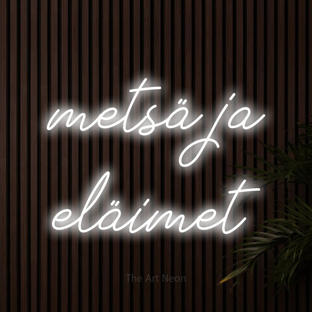 LED neon sign reading “metsä ja eläimet”, arranged in 2 lines.