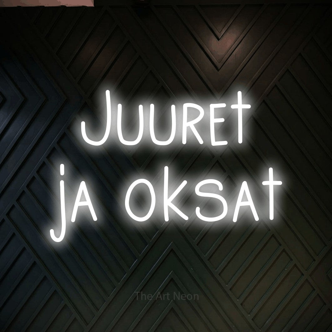 LED neon sign reading “Juuret ja oksat”, arranged in 2 lines.