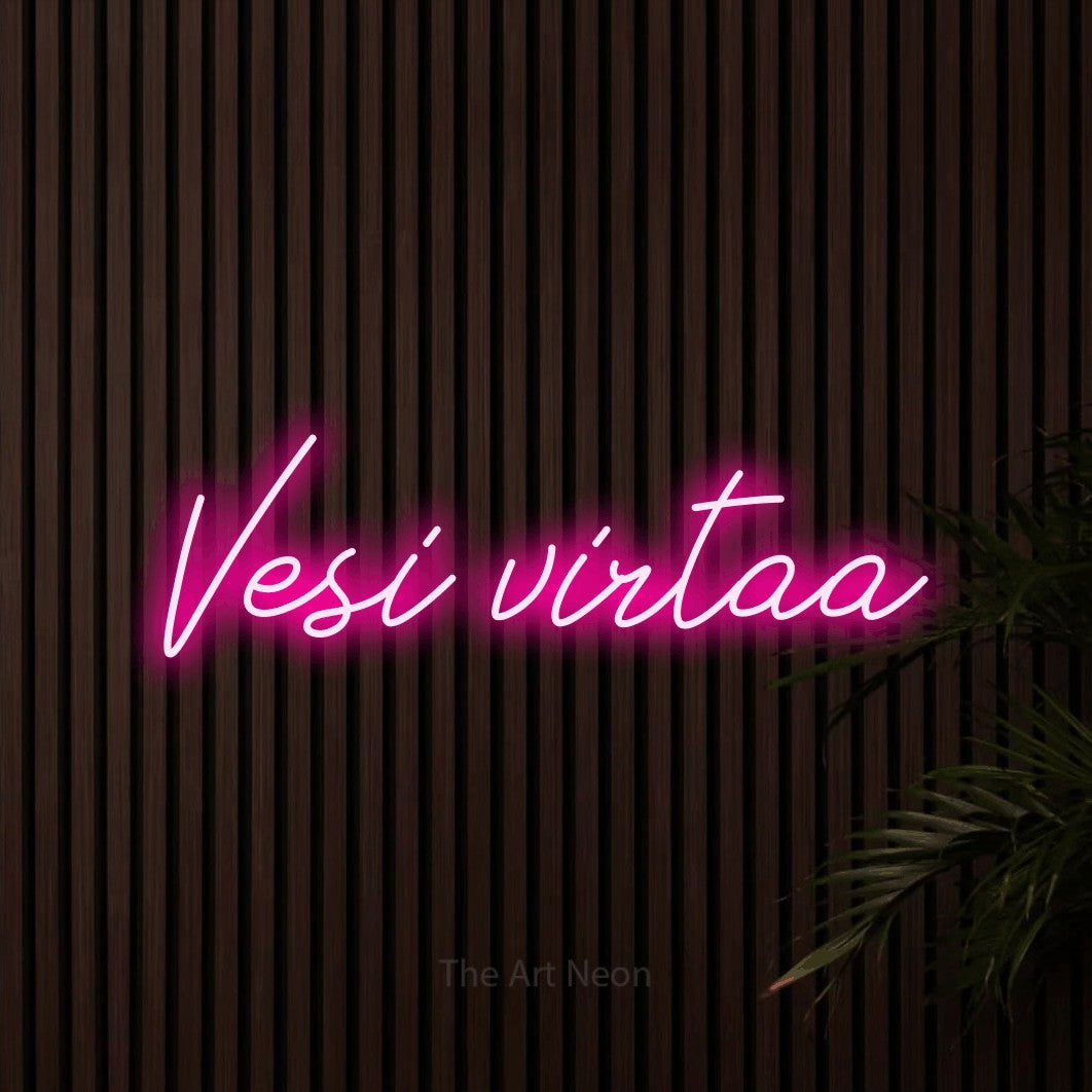 LED neon sign reading “Vesi virtaa”, arranged in a single line.