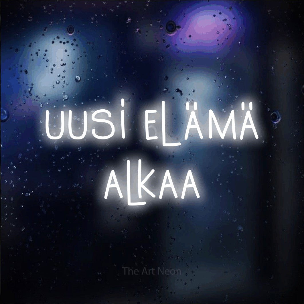 LED neon sign reading “uusi elämä alkaa”, arranged in 2 lines.
