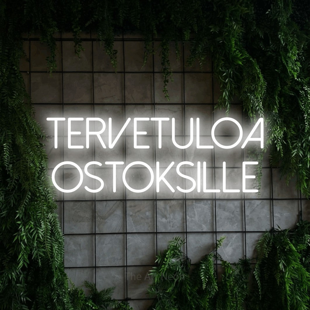 LED neon sign reading “Tervetuloa ostoksille”, arranged in 2 lines.