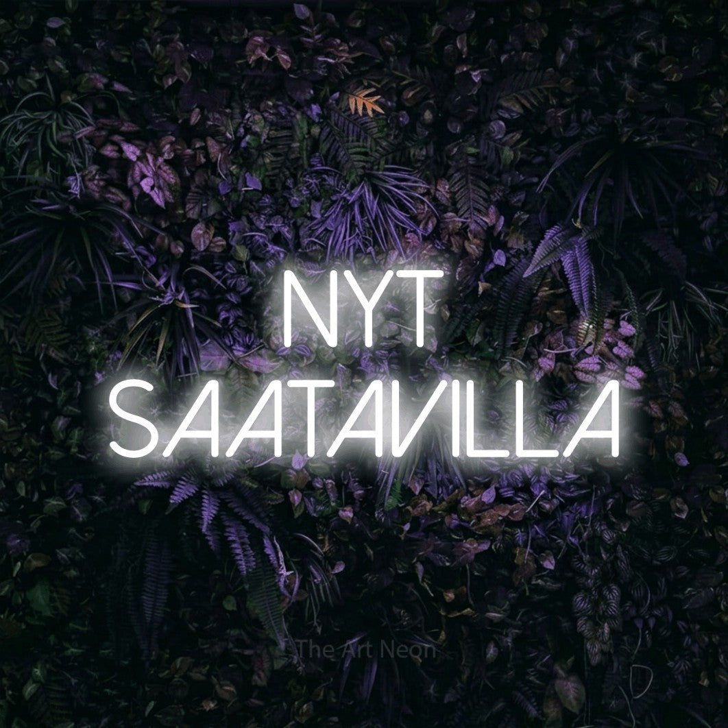 LED neon sign reading “Nyt saatavilla”, arranged in 2 lines.