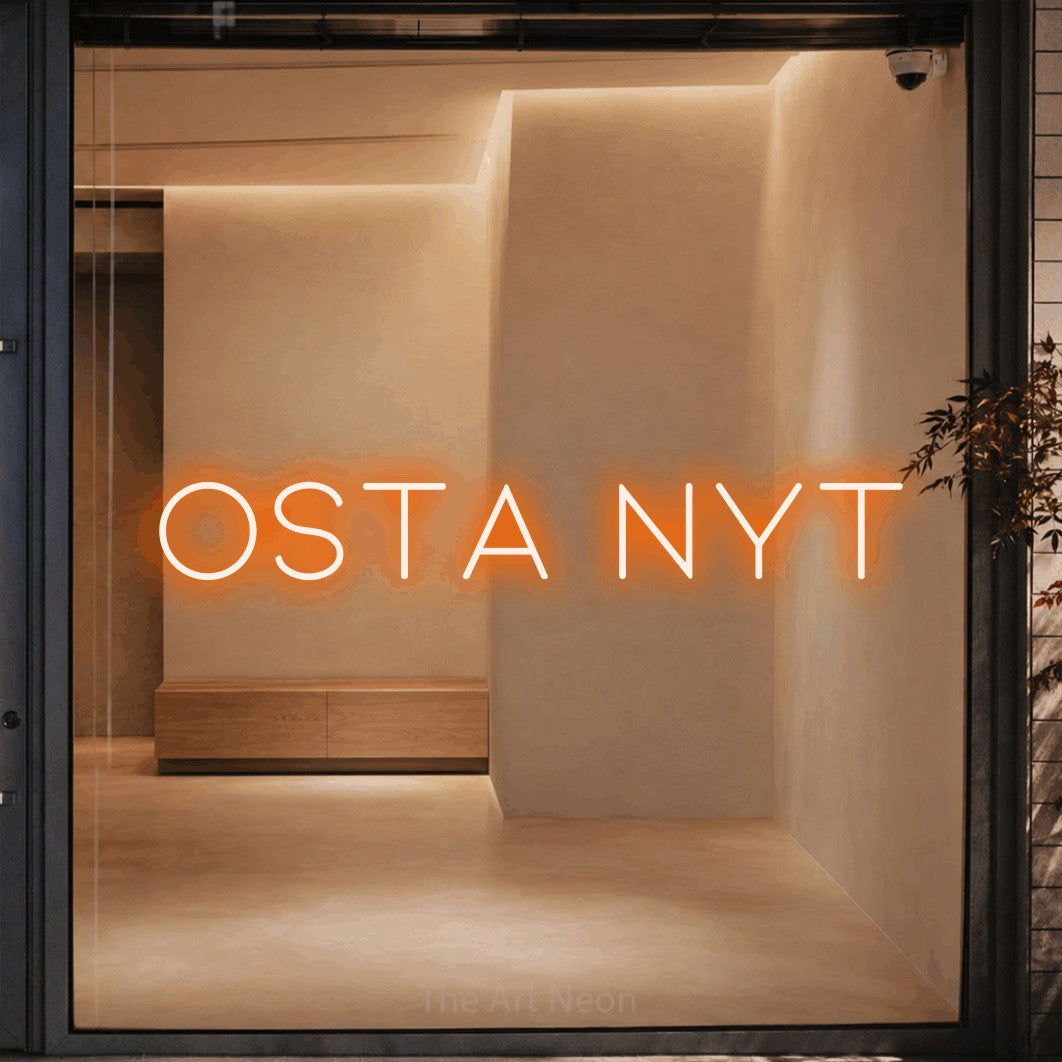 LED neon sign reading “Osta nyt”, arranged in a single line.