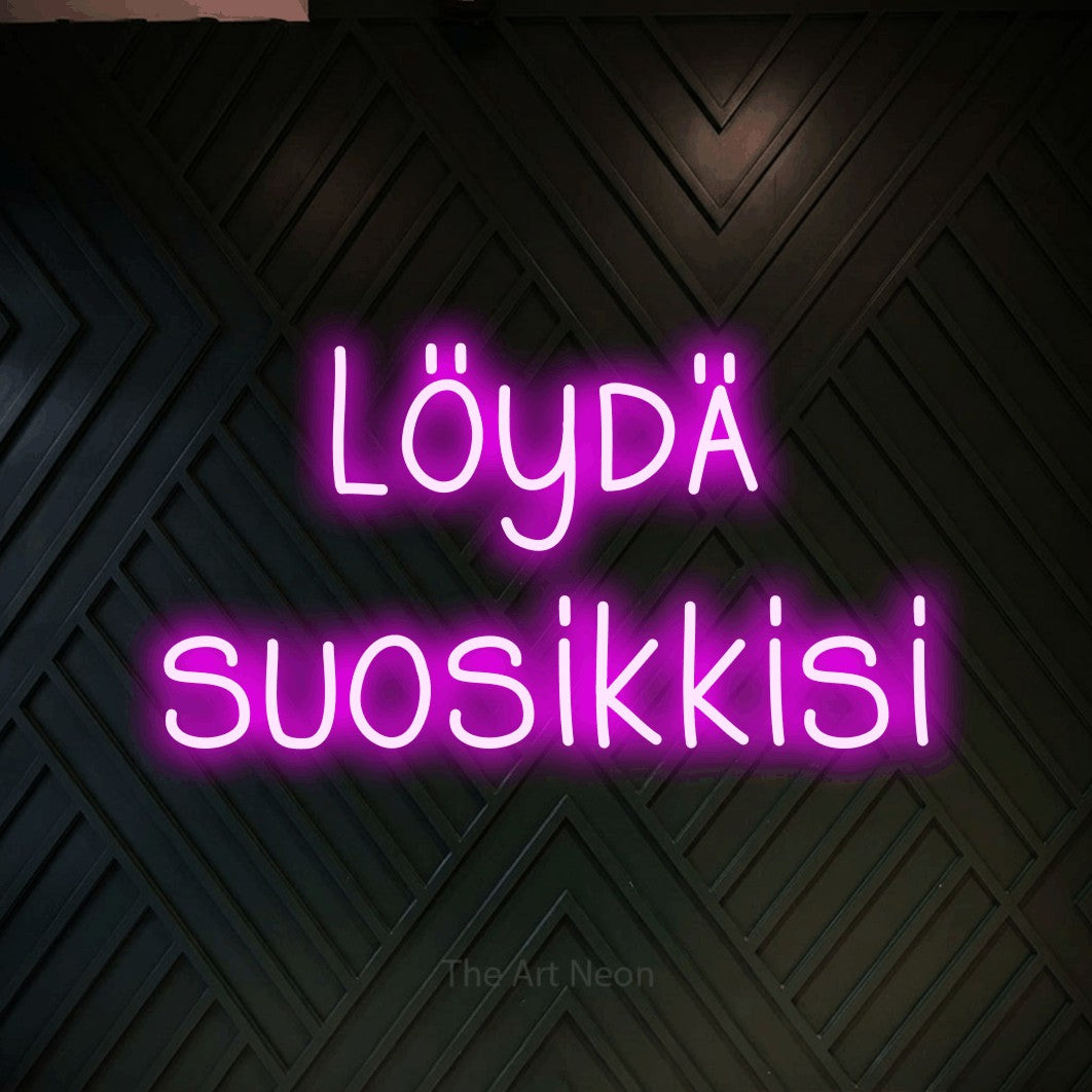 LED neon sign reading “Löydä suosikkisi”, arranged in 2 lines.