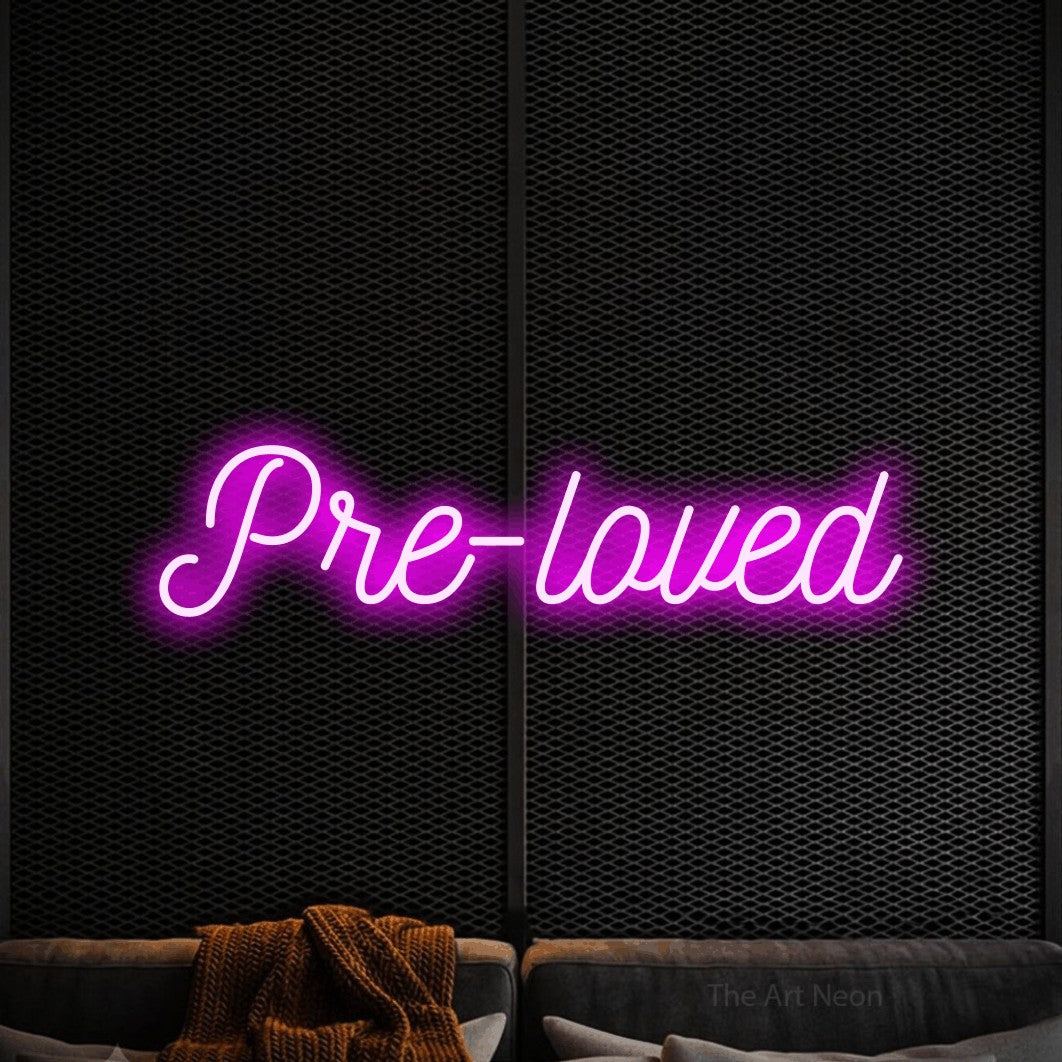 LED neon sign reading “Pre-loved”, arranged in a single line.